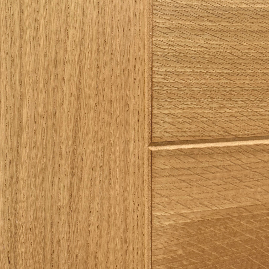 Close-up of wooden panel with visible grain and texture showing a v-groove detail