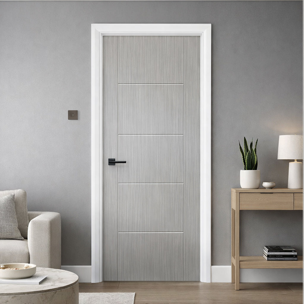An Iseo Nova Grey 35mm Laminate Door, with a Flat Black Hera Handle, in a modern interior home setting.