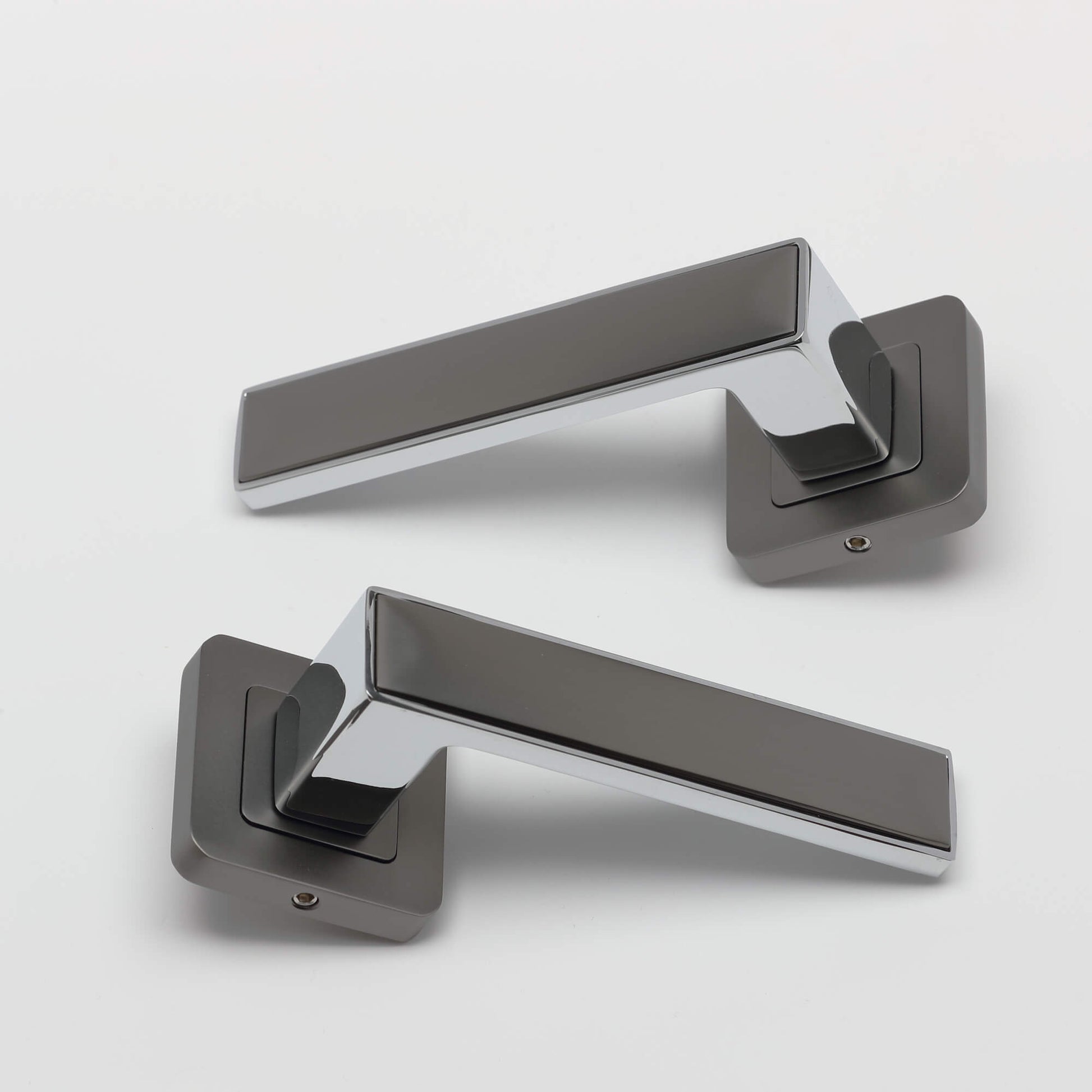A view of a pair of Alto Matt Satin Black & Polished Chrome Square Rose Handles on a white background.