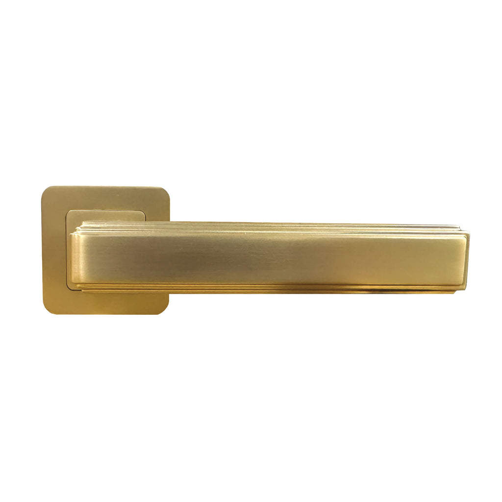 A front view of an Ares Satin Brass Square Rose door handle on a white background