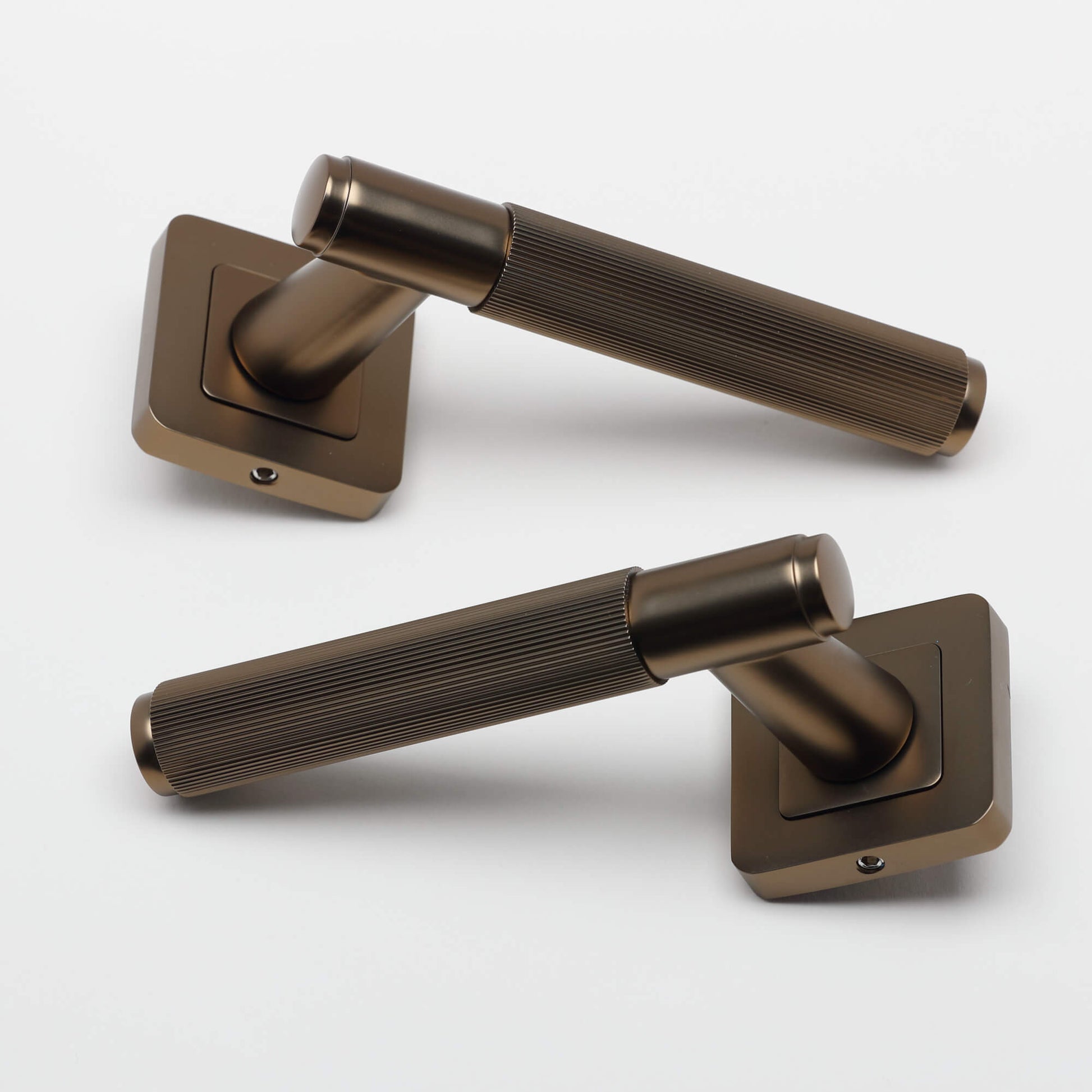 A pair of Athena Hermes Matt Coffee Square Rose Handle on a white background.