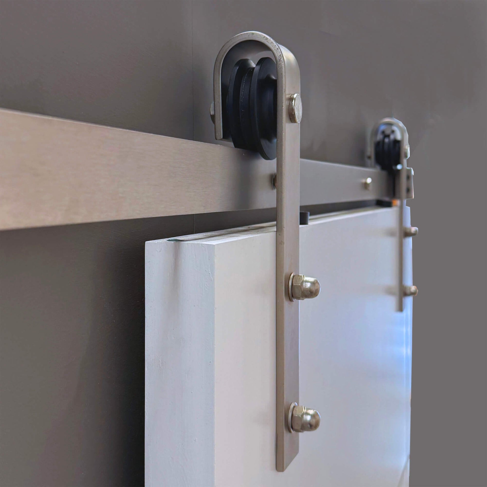 Side view of the Brushed Steel Barn Door Track mechanism.