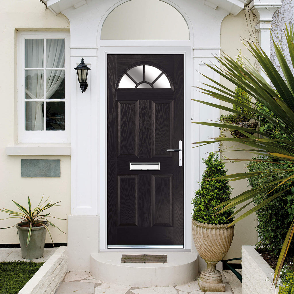 A black Carolina Composite GRP Door with obscure glazing in a home front exterior