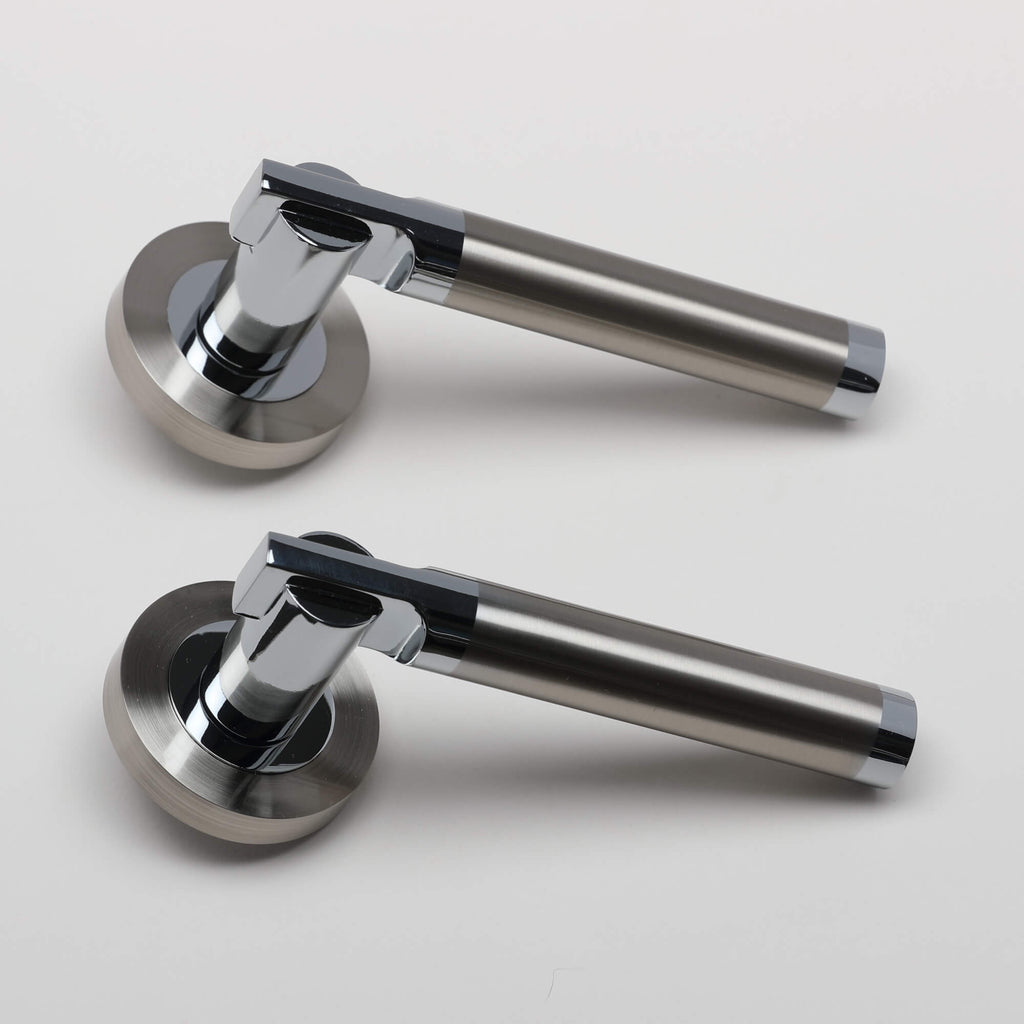 A pair of Cumulus Nickel Brushed & Polished Chrome Handles on a light grey background.