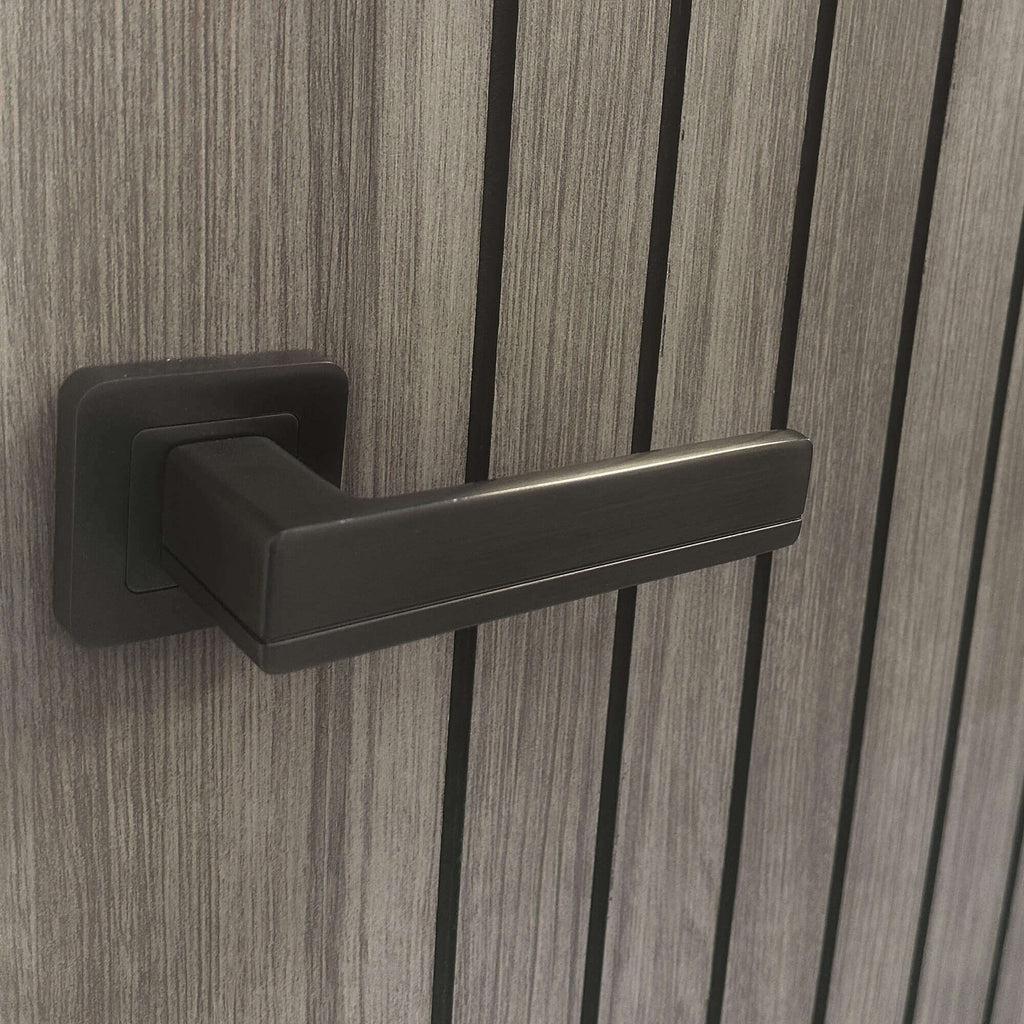 Close-up of a Hermes Matt Satin Black Square Rose Handle on an Ottawa Laminate Internal Door.