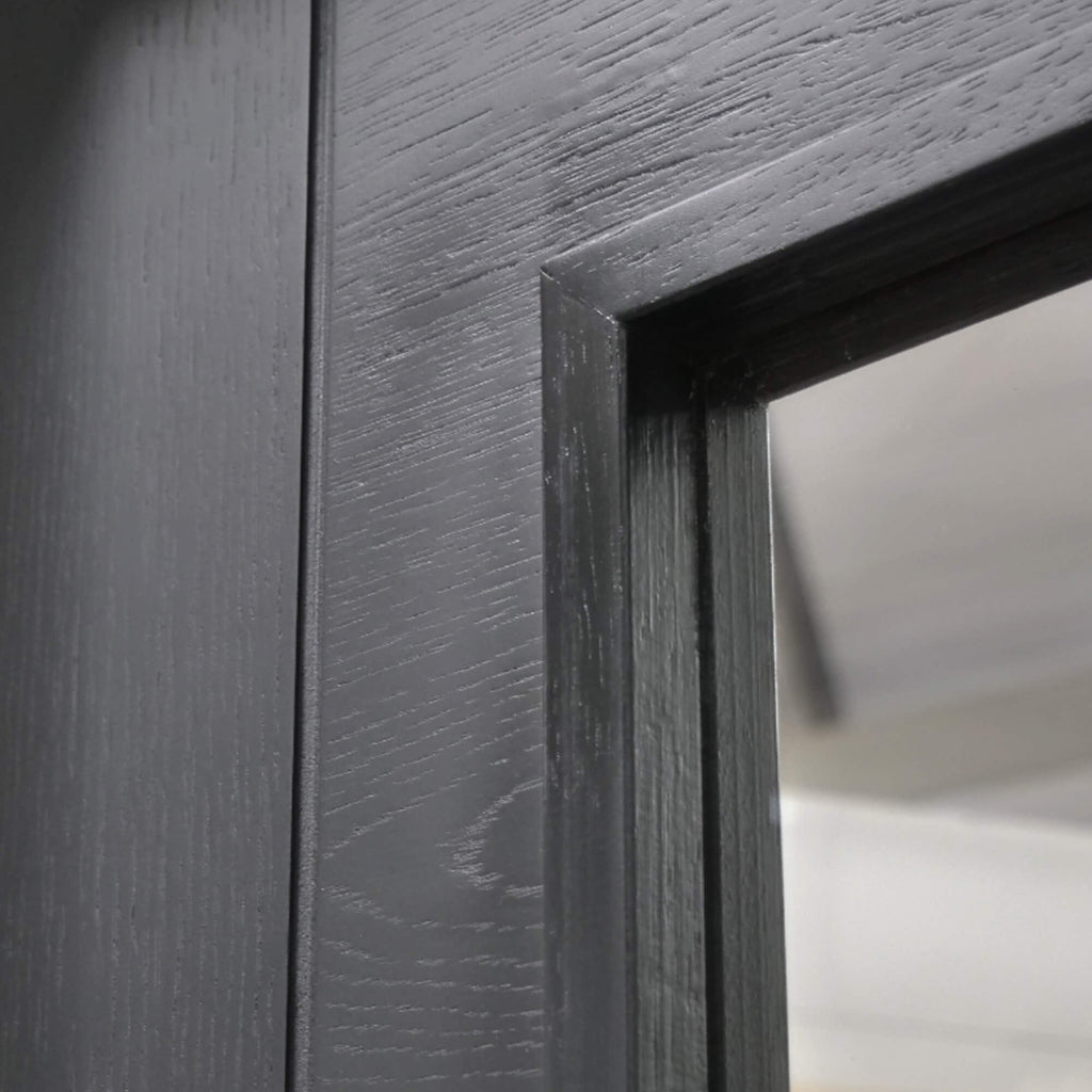 Close-up of an Iseo Black Primer Plus 1 Lite Pre-Glazed Door showing the groove and glass panel.