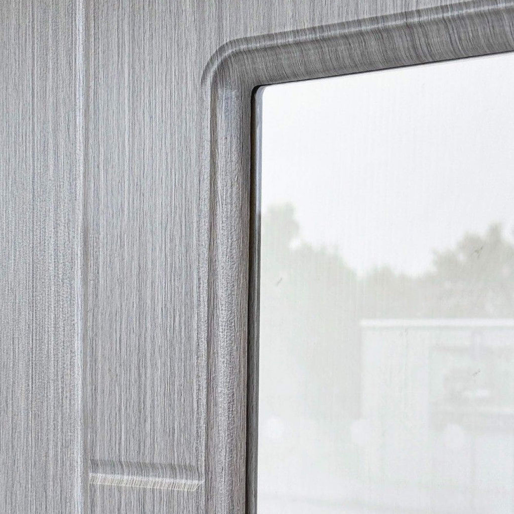Close-up of the grooves and grain on an Iseo Nova Grey 1 Lite Pre-Glazed Internal 35mm Laminate Door.