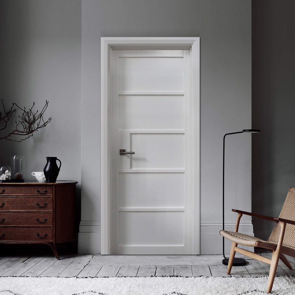 The Kew White Primer Plus 5 Panel Door in an interior setting.