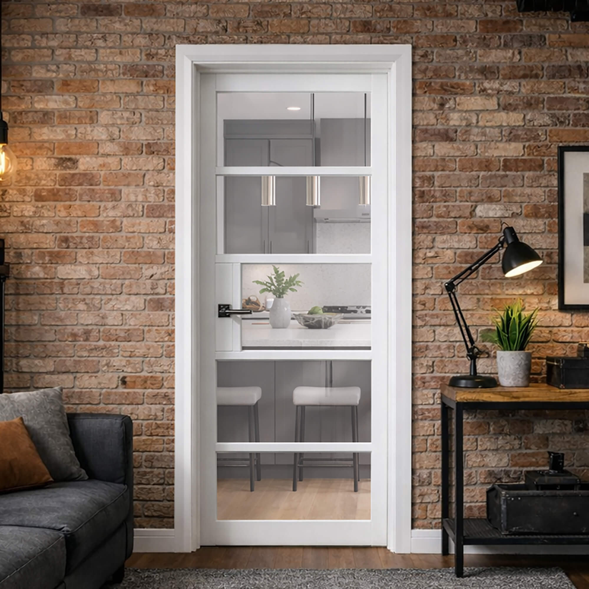 A Kew White Primer Plus 5 Lite Pre-Glazed Door  in a living room setting, looking into a modern kitchen.