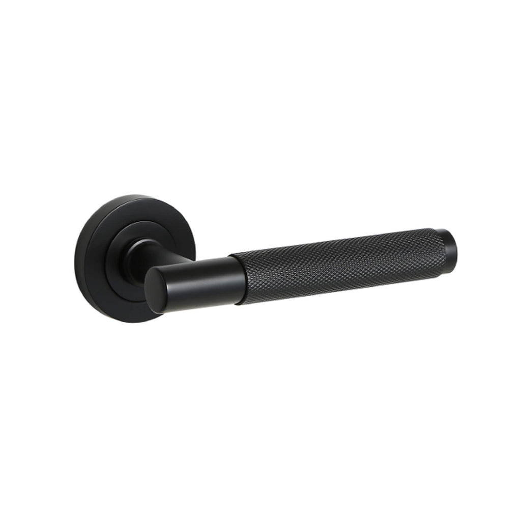 Knurled Flat Black door handle on a white background