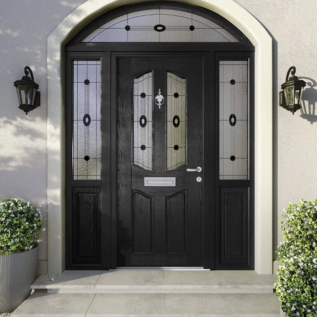 A Black Lismore Composite GRP Front External Door with decorative glass panels on a modern house exterior.