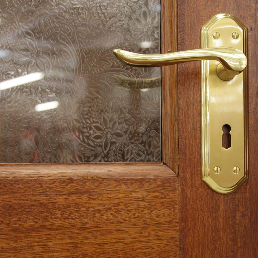 Close-up of a Mayfair Mahogany Unglazed Door 44mm External Door with a  Monet Handle