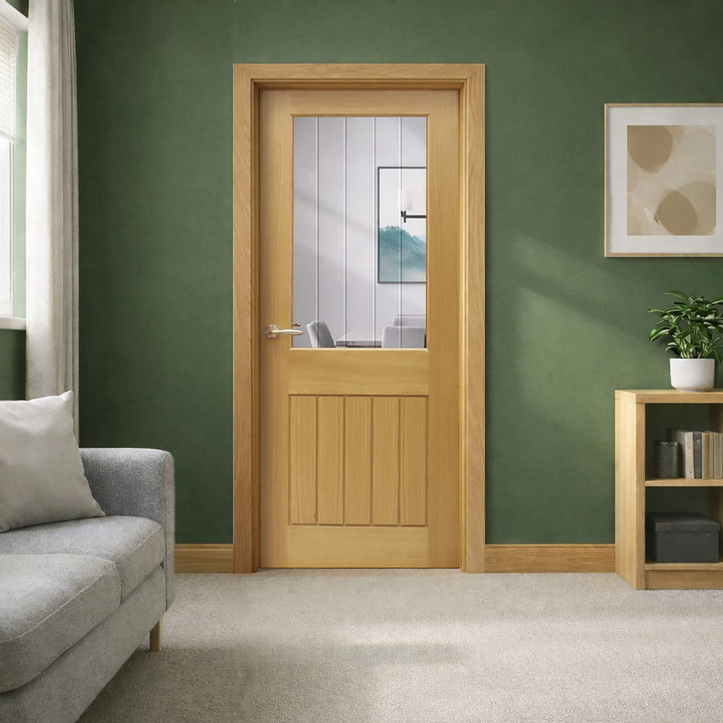 A Mexicano White Oak Door 1 Lite Pre-Glazed 40mm Internal Door  with Diamond-Cut Toughened glass in a home living room setting with a sofa and bookcase.