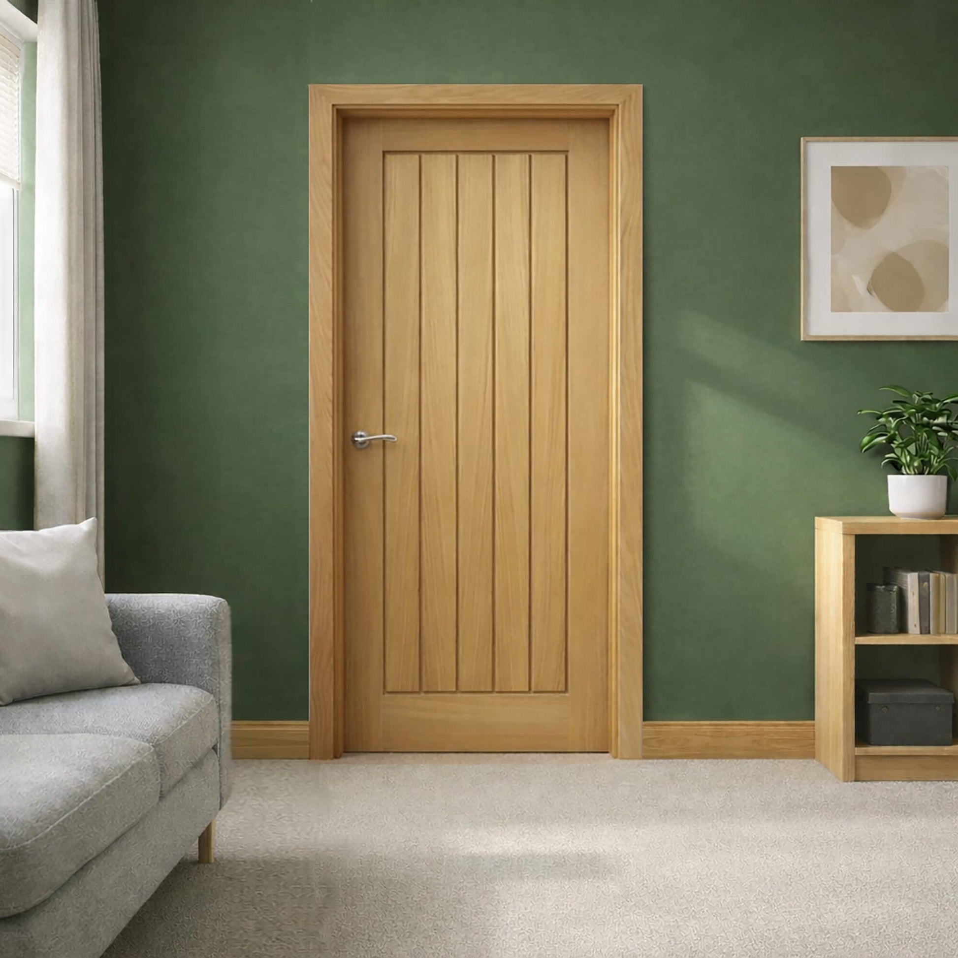 A Mexicano White Oak Internal Door in a living room setting with a sofa, bookcase and painting on an olive green wall.