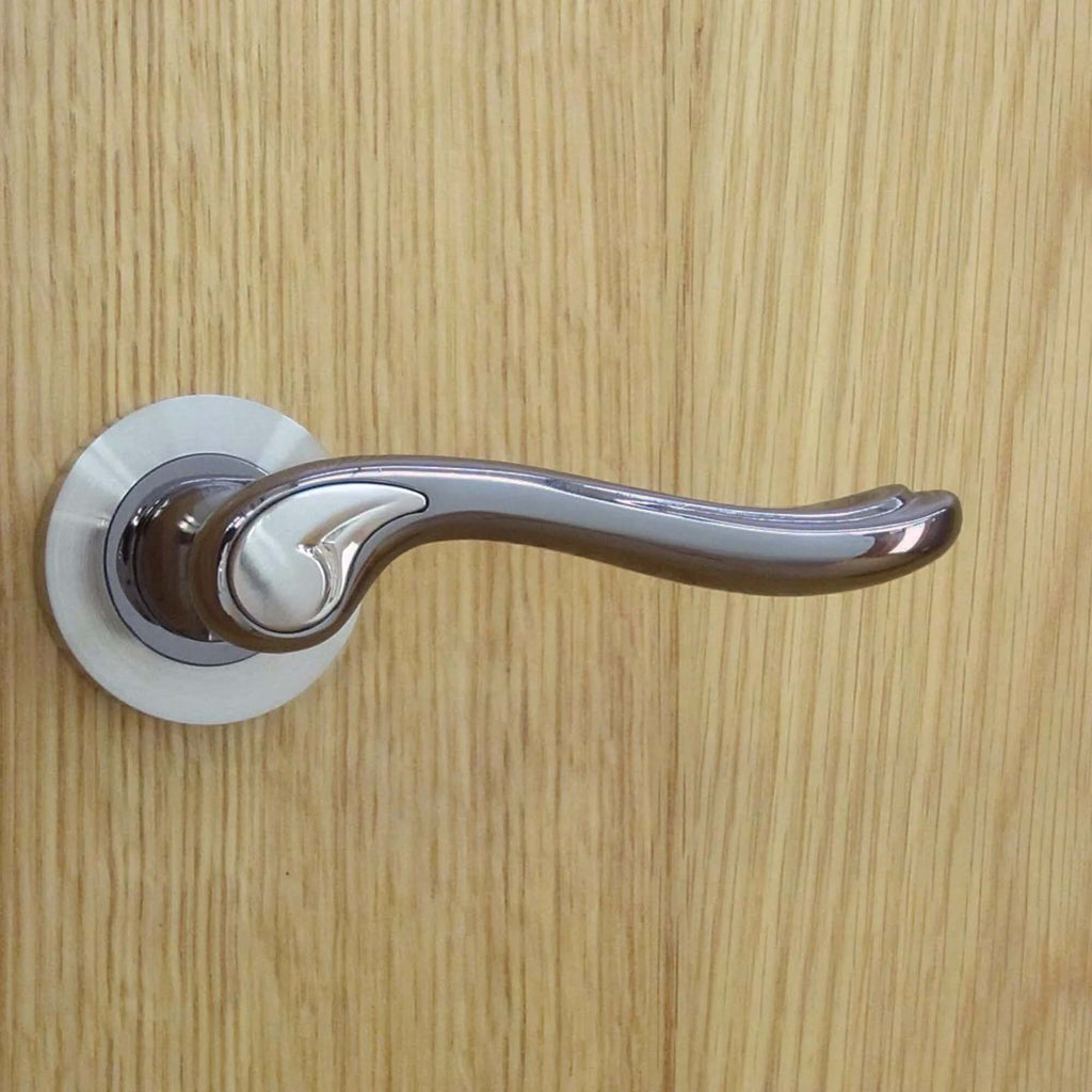 Monet Black Nickel & Nickel Brushed round rose door handle on a oak wooden door