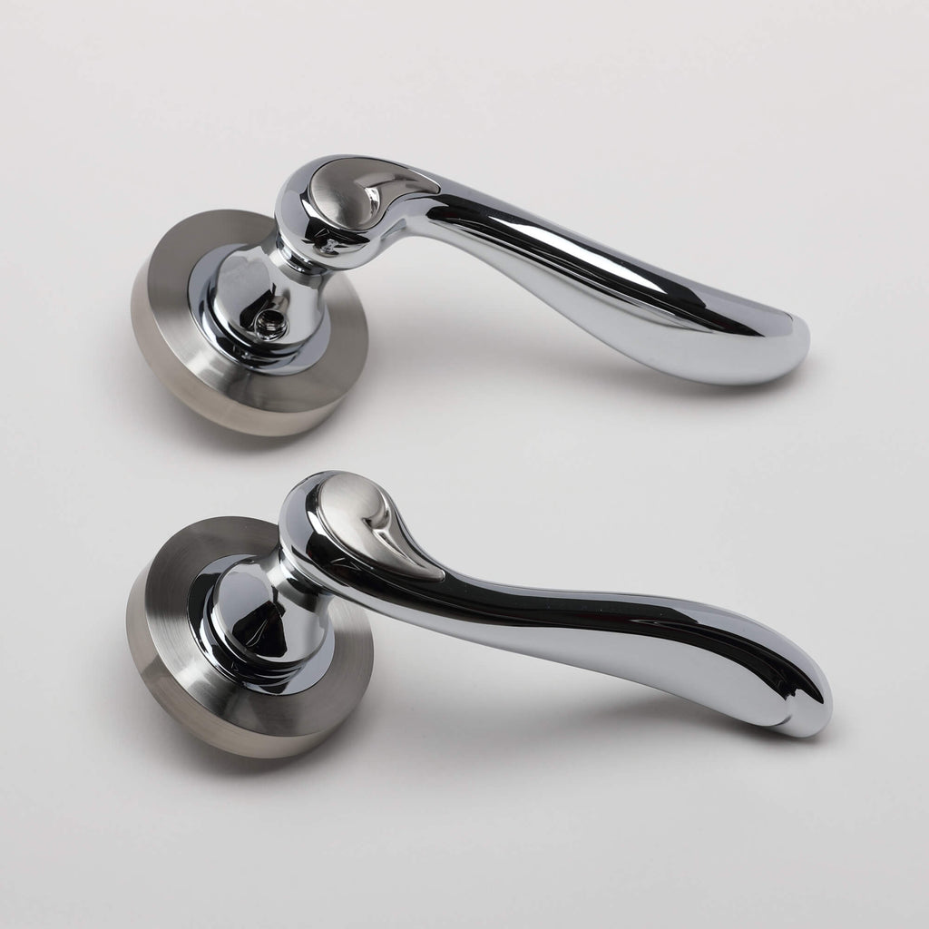 A side view of a pair of Monet Nickel Brushed & Polished Chrome Handles on a white background.