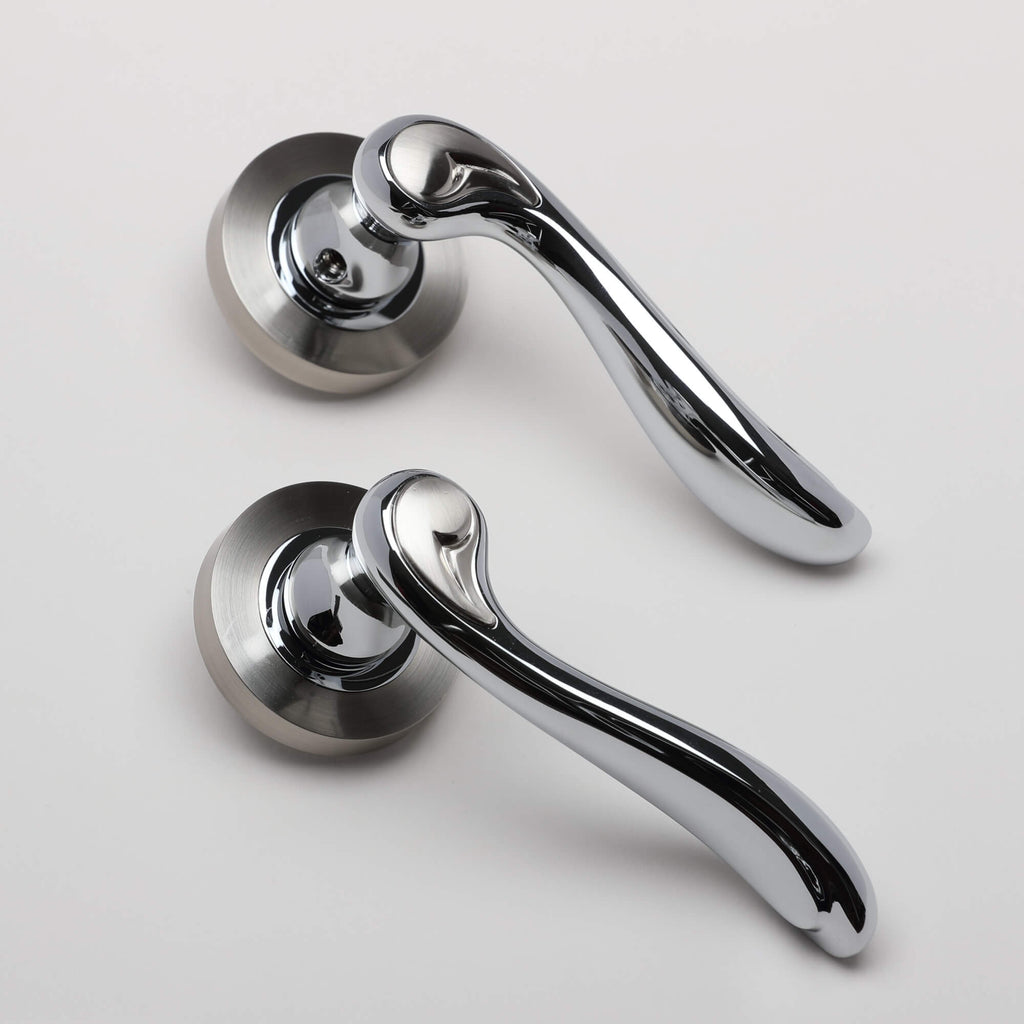 An angled view of a pair of Monet Nickel Brushed & Polished Chrome Handles on a white background.