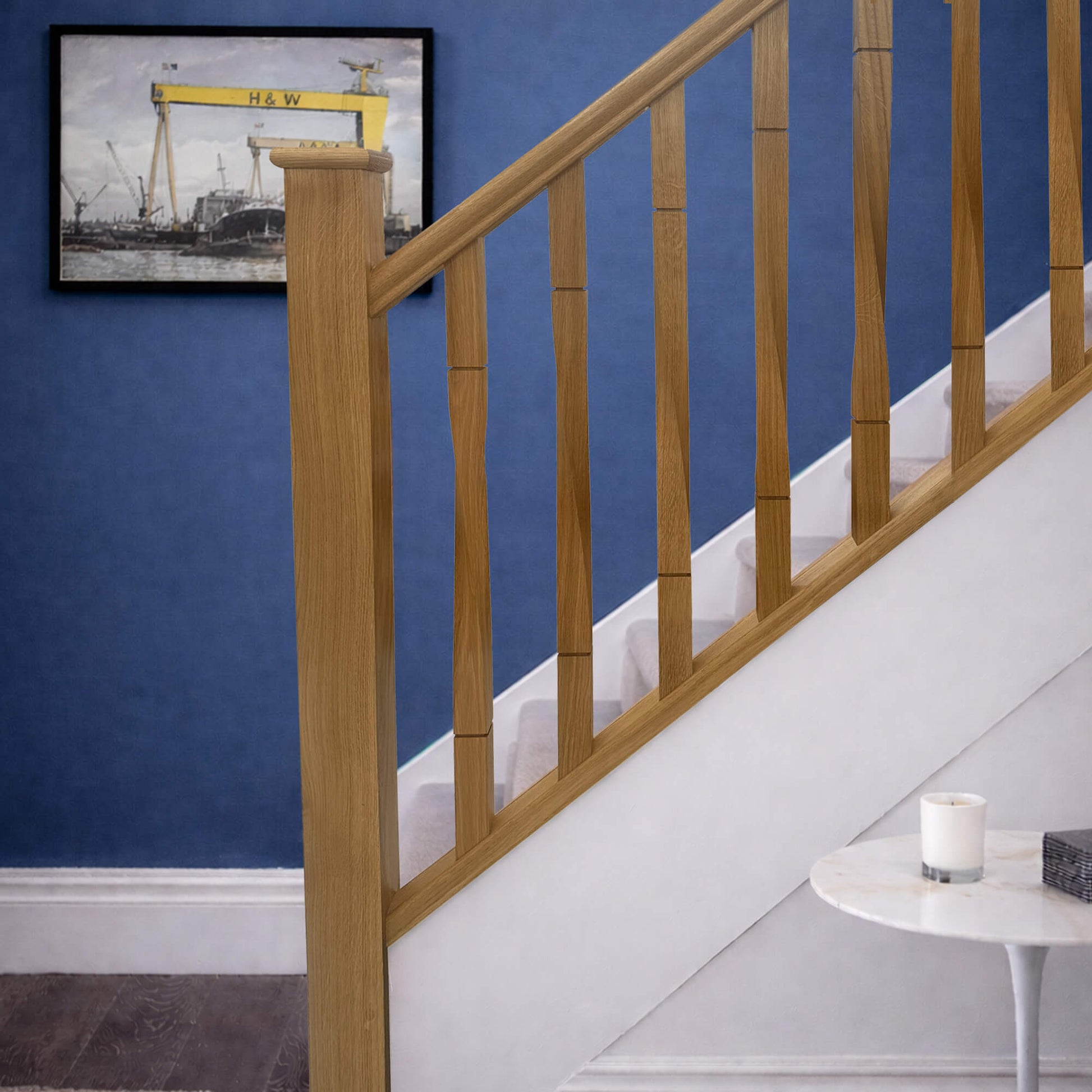 An Oak Staircase with Oak Roma Twist Spindles and Oak Baserail and Handrail in a home interior.