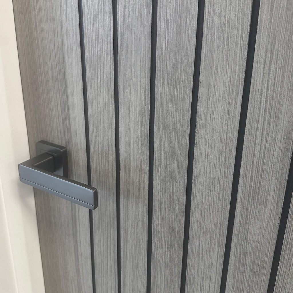 Close-up of an Ottawa Lava Grey 35mm Internal Laminate Door with a Flat Black Hermes handle.