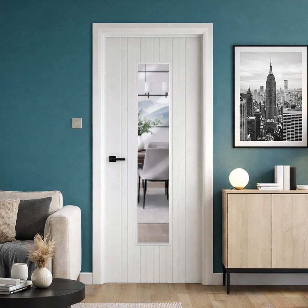 An Ottawa White Primed 1 Lite Pre-Glazed Internal Door in a home setting with modern interior design with a blue wall, and wooden furniture.