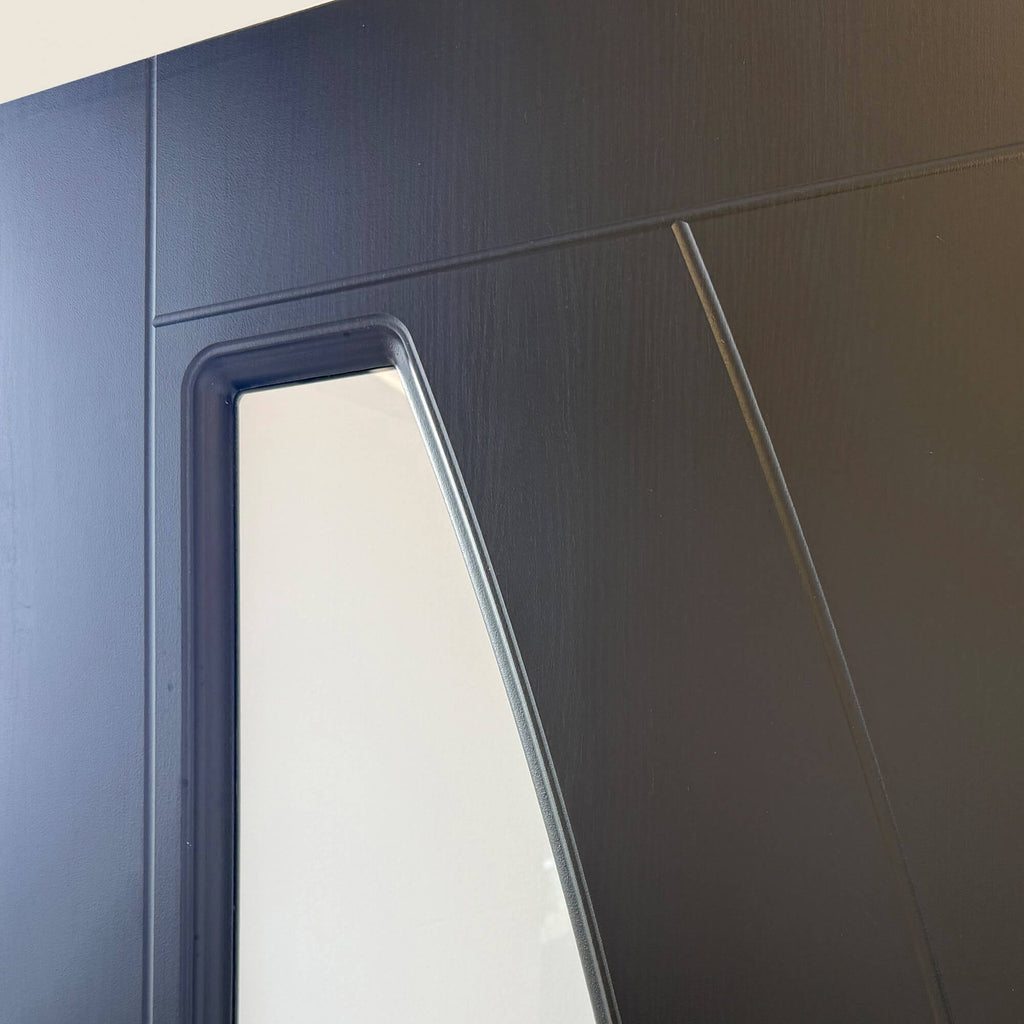 Close-up of the 4mm toughened glass panel on a Salerno Black Ash 35mm 1 lite laminate door.