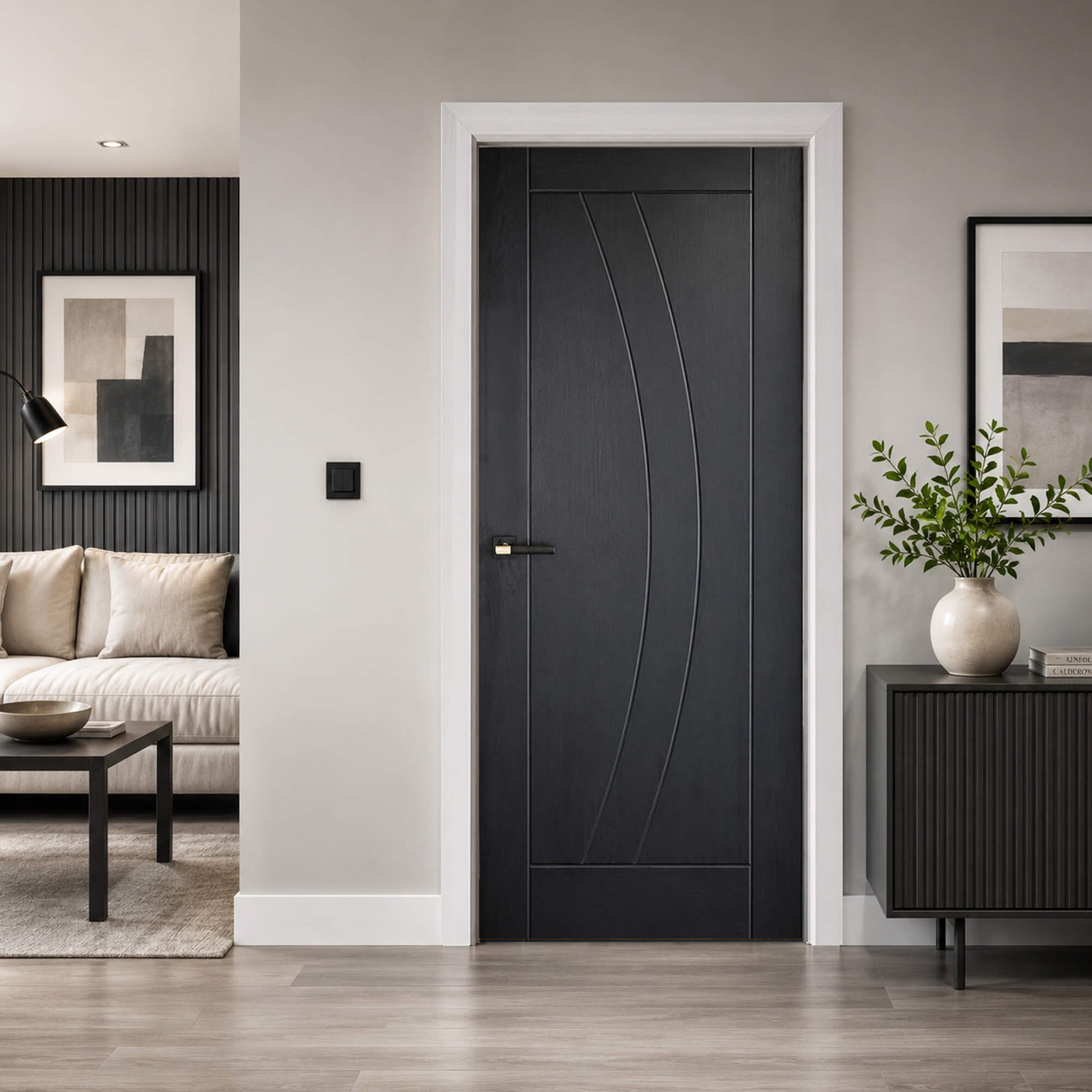 Modern interior Salerno Black Ash laminate door in a living room setting with decor elements.