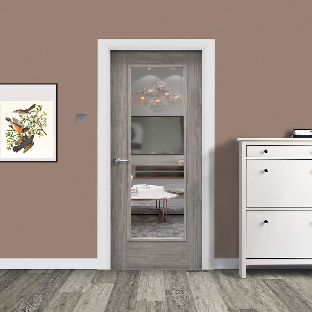 A Shaker Lava Grey 1 Lite Unglazed 40mm Internal Laminate Door, with 4mm clear toughened glass inserted and a Storm door handle, in a home interior setting.