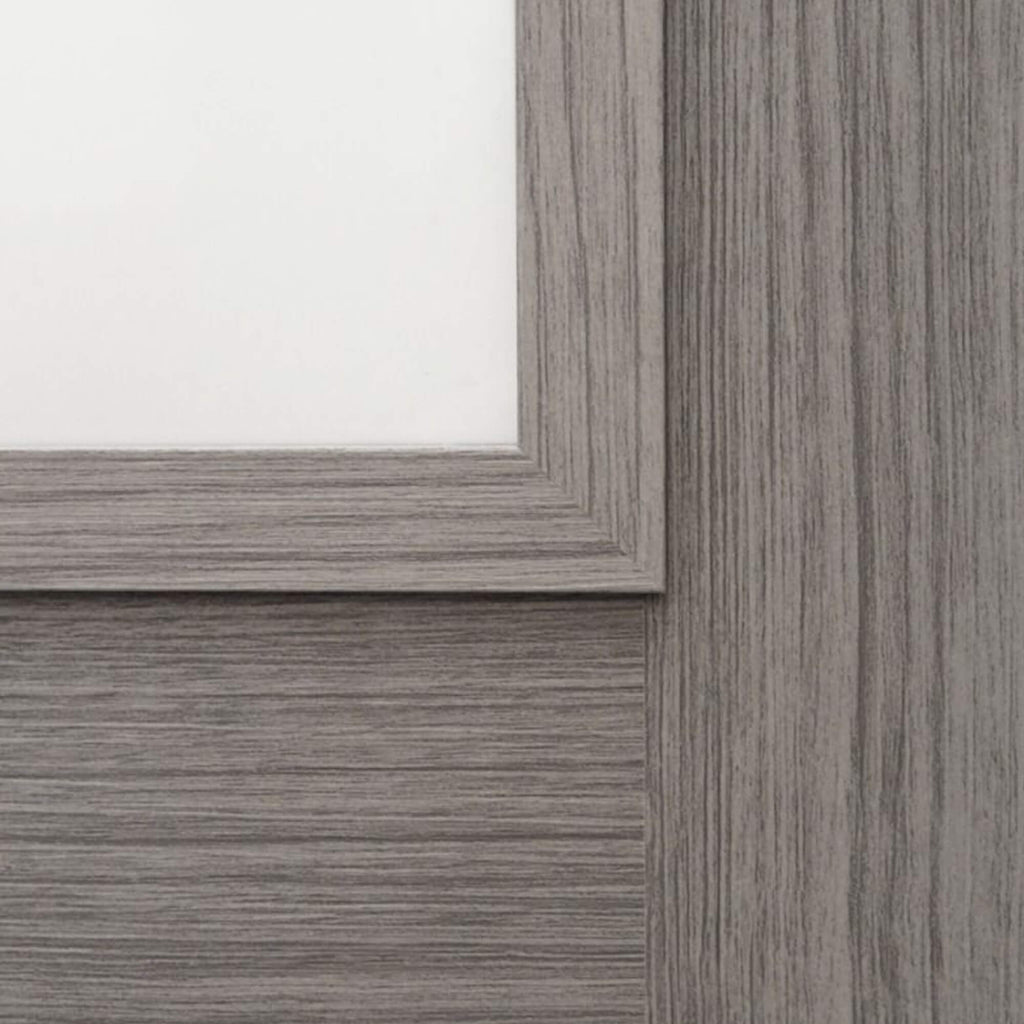 Close-up of a wooden panelling and woodgrain on a Shaker Lava Grey 1 Lite Unglazed 40mm Internal Laminate Door, with 4mm reeded glass inserted and a Storm door handle.