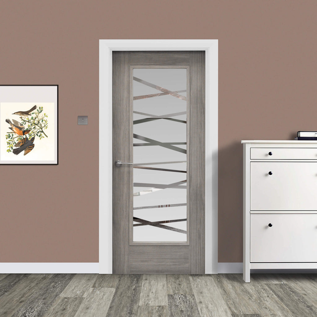 A Shaker Lava Grey 1 Lite Unglazed 40mm Internal Laminate Door, with 4mm DS7 decorative glass inserted and a Storm door handle, in a home interior setting.