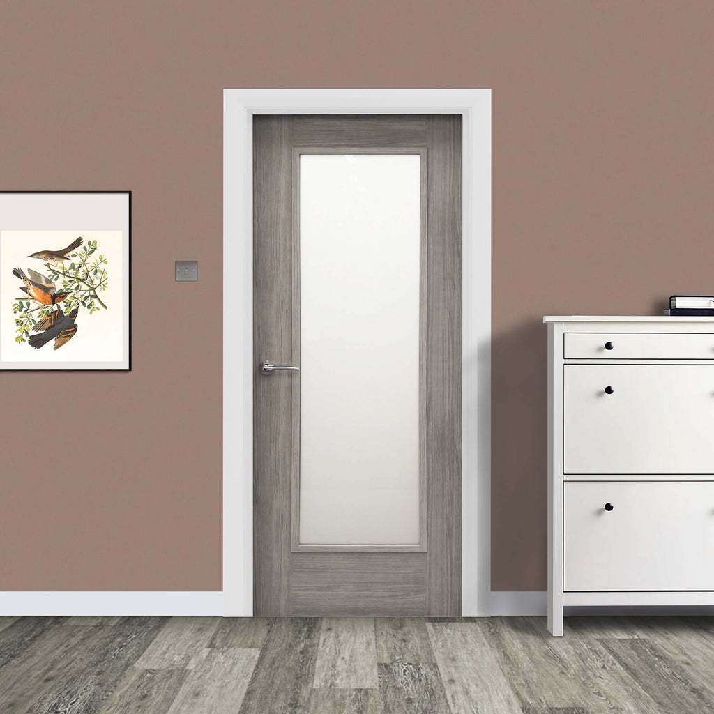 A Shaker Lava Grey 1 Lite Unglazed 40mm Internal Laminate Door, with 4mm sandblasted glass inserted and a Storm door handle, in a home interior setting.