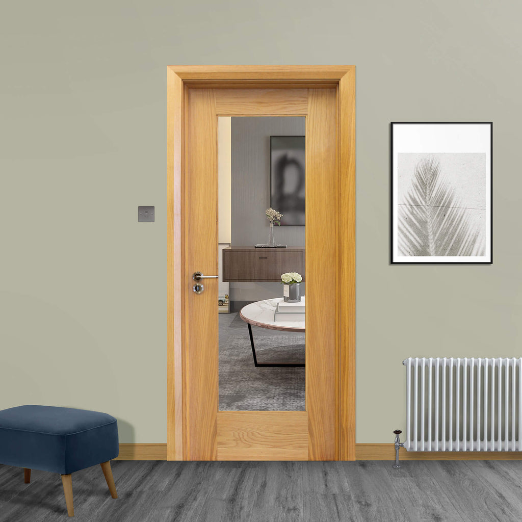 A Shaker White Oak 1 Lite 40mmUnglazed Door, with 4mm toughened clear glass inserted with a Tempest handle installed, in a home interior setting.