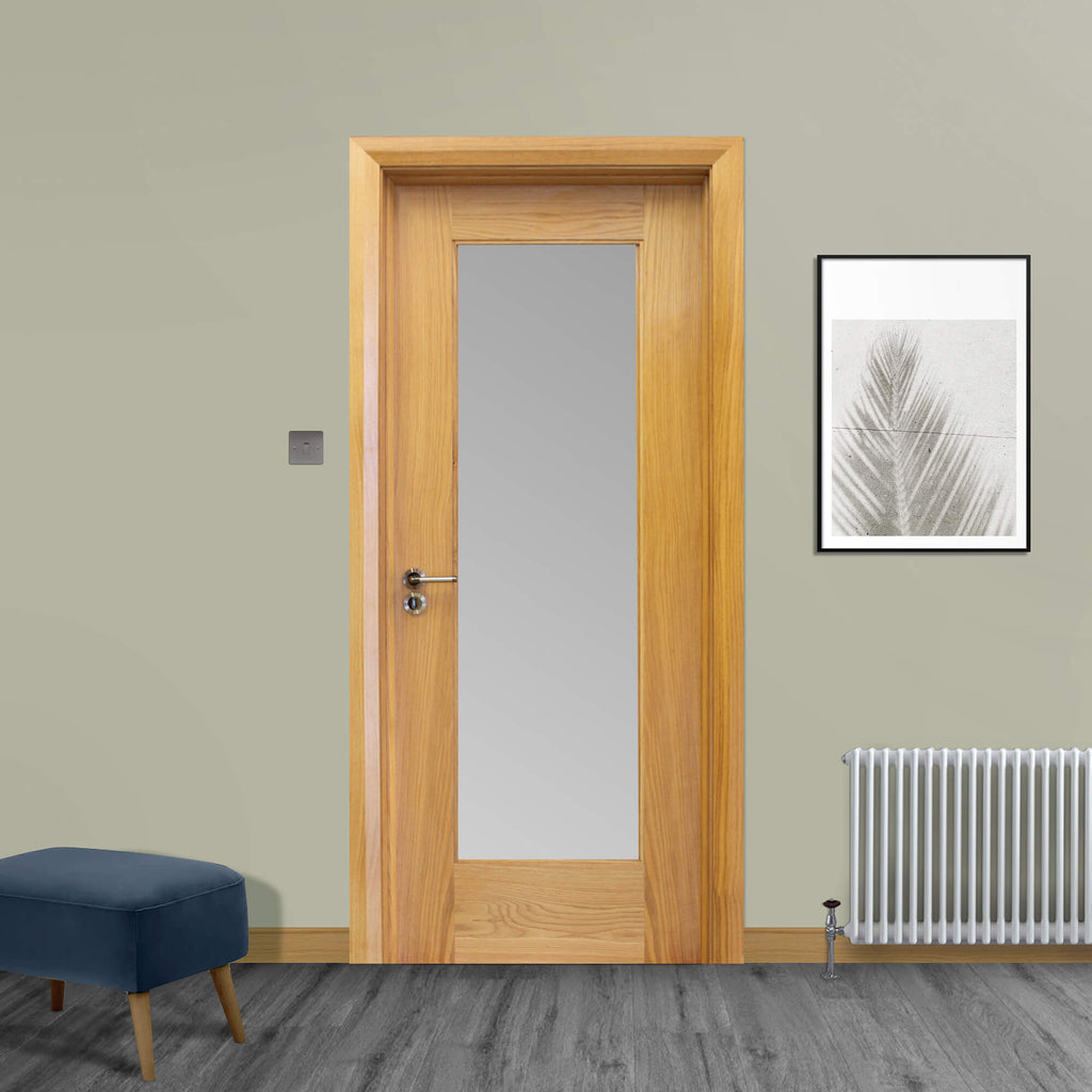 A Shaker White Oak 1 Lite 40mmUnglazed Door, with 4mm toughened sandblasted glass inserted with a Tempest handle installed, in a home interior setting.