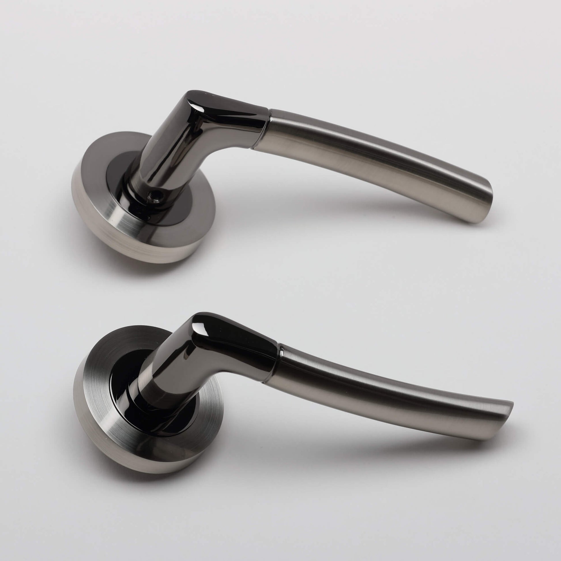 A side view of a pair of Storm Black Nickel & Nickel Brushed Handle on a white background.