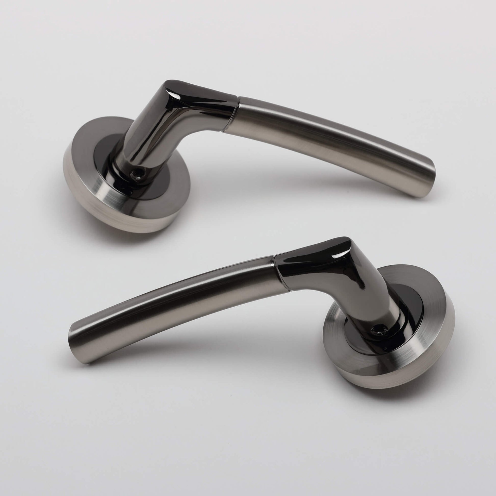 A set of Storm Black Nickel & Nickel Brushed Handles on a white background.
