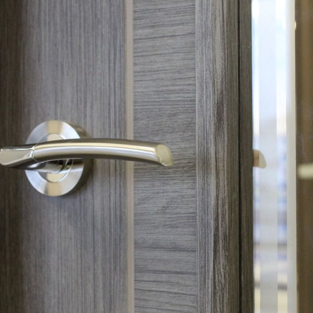 Close-up of the groves and woodgrain on a Tigris Granite Grey 1 Lite Unglazed 40mm Internal Laminate Door, with 4mm  toughened glass and Storm door handle.