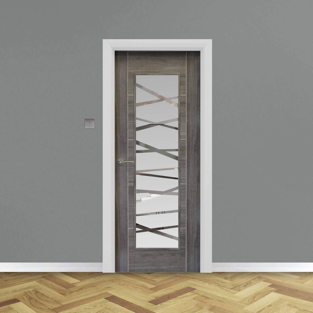 A Tigris Granite Grey 1 Lite Unglazed 40mm Internal Laminate Door, with 4mm DS7 decorative glass and Storm door handle, in a home interior setting.