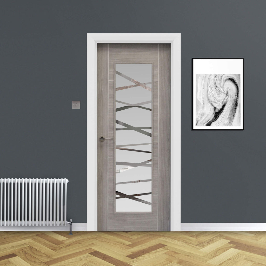 A Tigris Lava Grey 1 Lite Unglazed 40mm Internal Laminate Door, with a Storm handle and 4mm DS7 decorative glass, in a home interior setting.