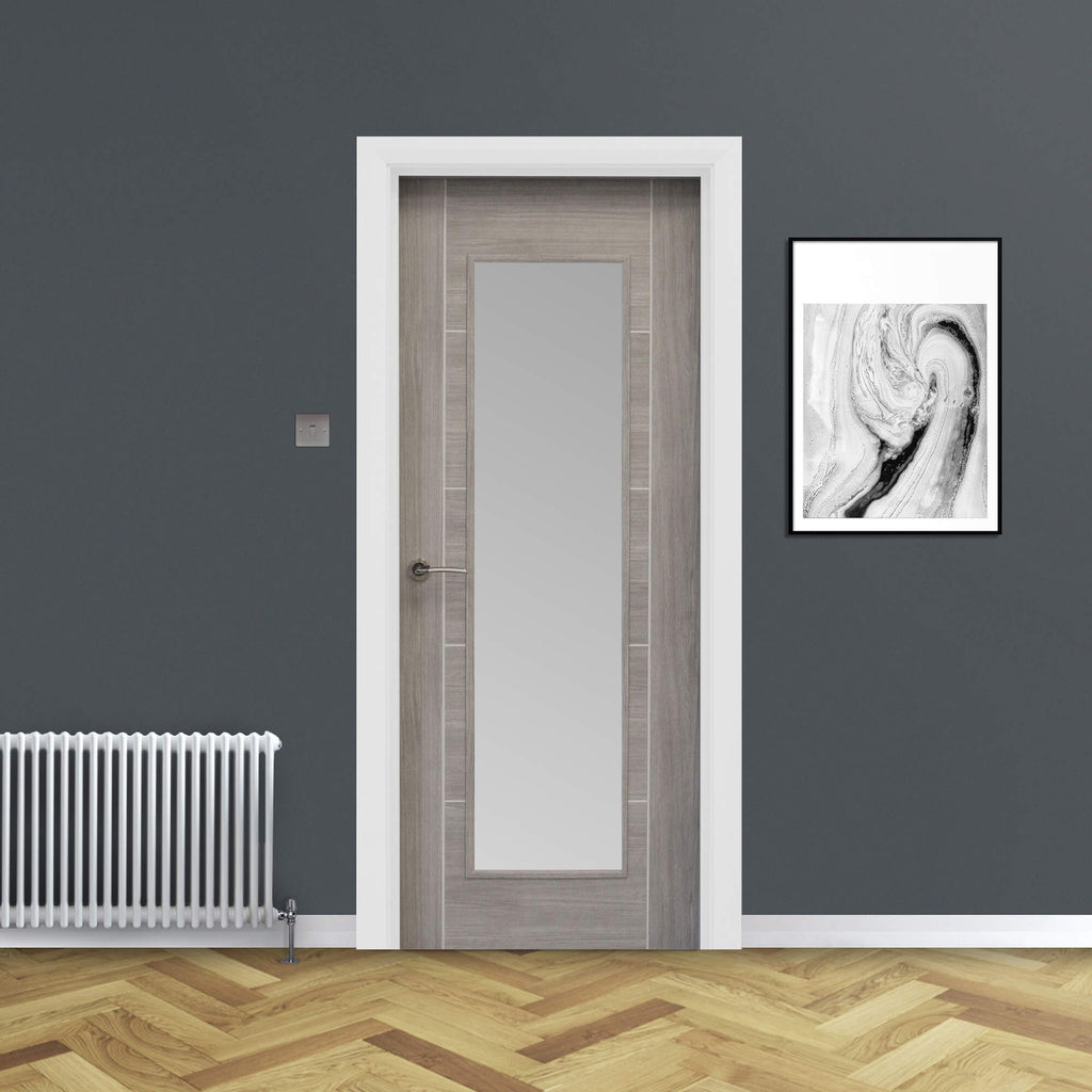 A Tigris Lava Grey 1 Lite Unglazed 40mm Internal Laminate Door, with a Storm handle and 4mm sandblasted toughened glass, in a home interior setting.