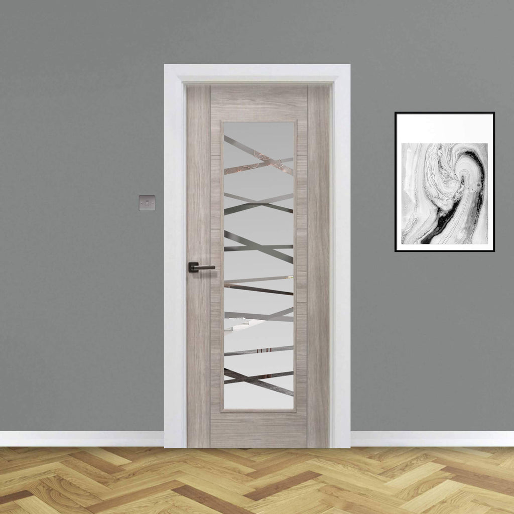 A Tigris Stone Grey 1 Lite Unglazed 40mm Internal Laminate Door, with 4mm DS7 decorative glass and an Alto handle, in a home interior setting.