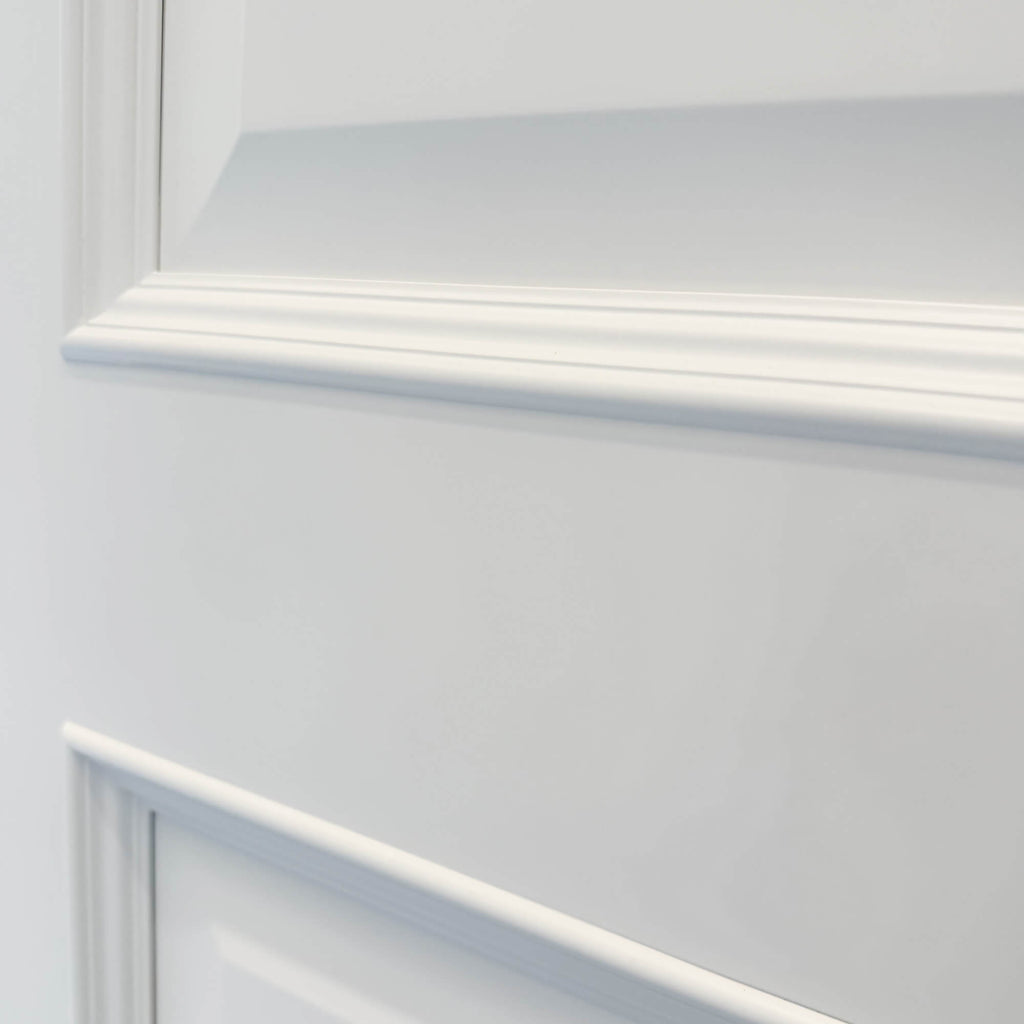 Close up of the panelling on a Toledo White Primer Plus 3 Panel Door.