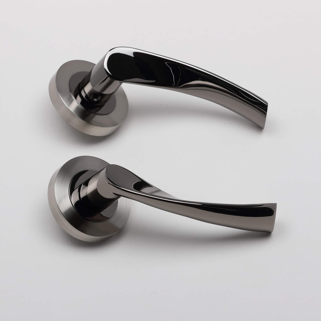 Side view of a pair of Trade Range Black Nickel & Nickel Brushed Door handles on a light grey background.