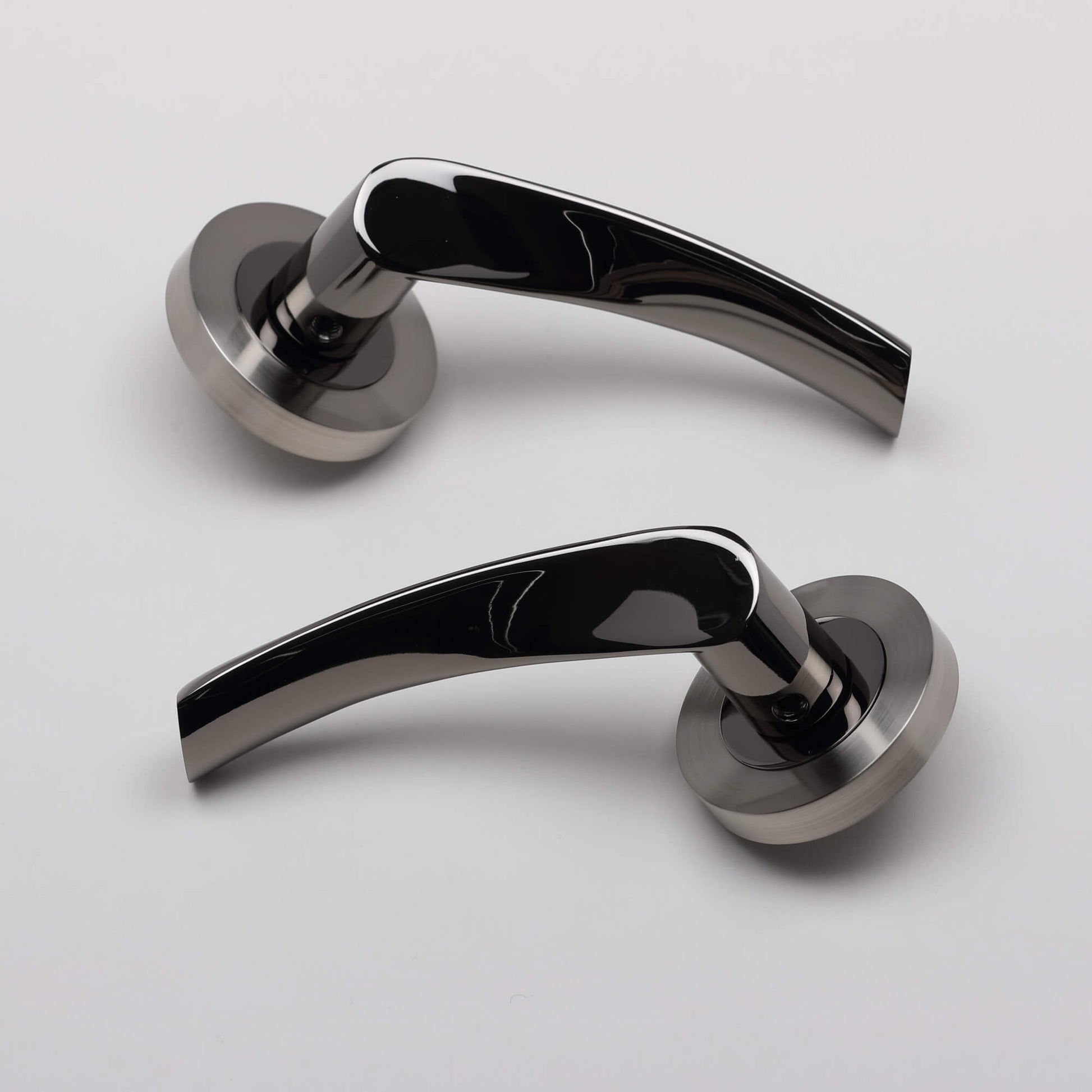 Pair of Trade Range Black Nickel & Nickel Brushed Door handles on a light grey background.