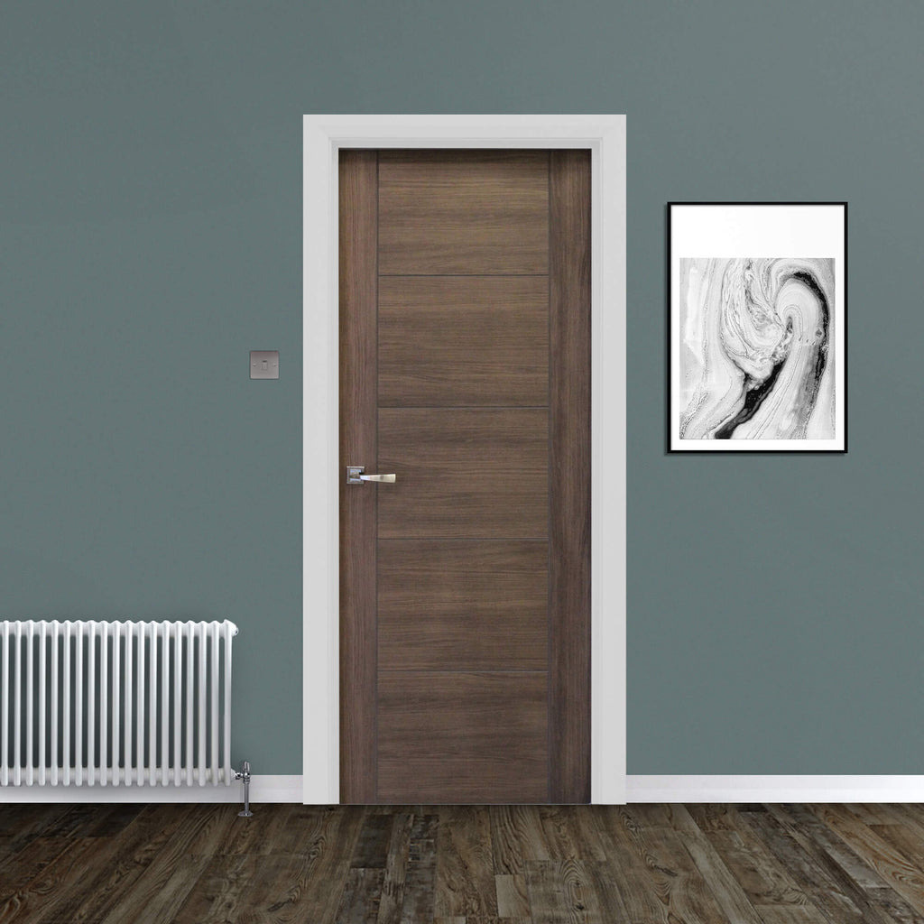 A Vancouver Walnut Laminate FD30 44mm Internal Fire Door, with an Arcus handle, in a home interior setting.