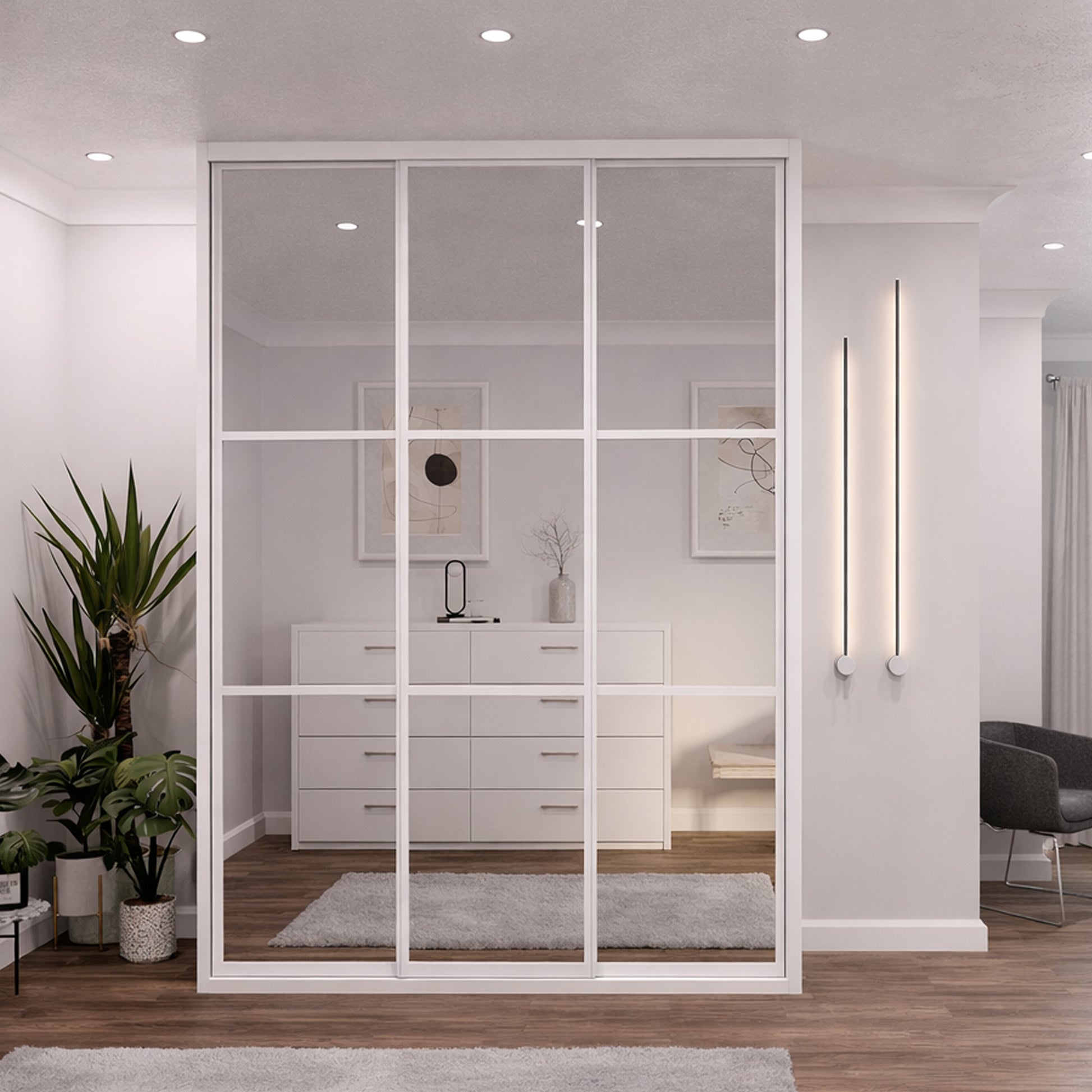 Modern interior with White Framed Mirrored Doors added to a wardrobe partition with white cabinets, and decorative elements reflected in the mirrors.