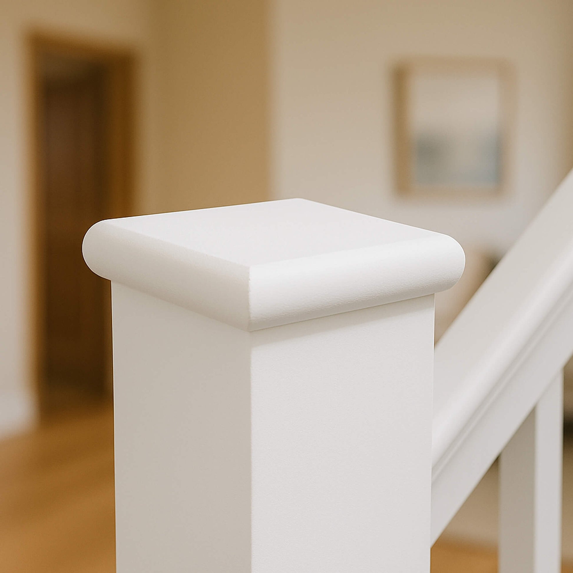White Primed Flat Newel Cap with a blurred background