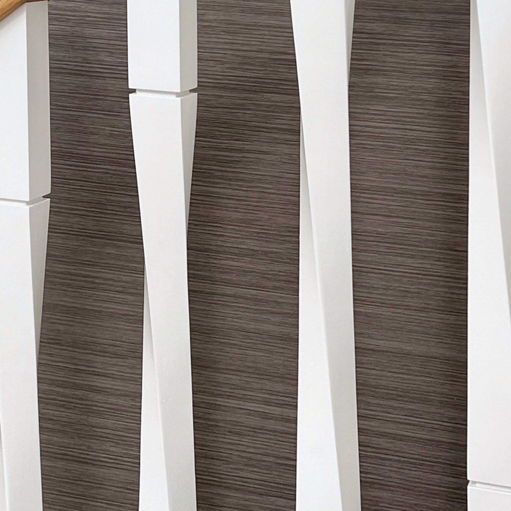 Close-up of white primed Roma spindles