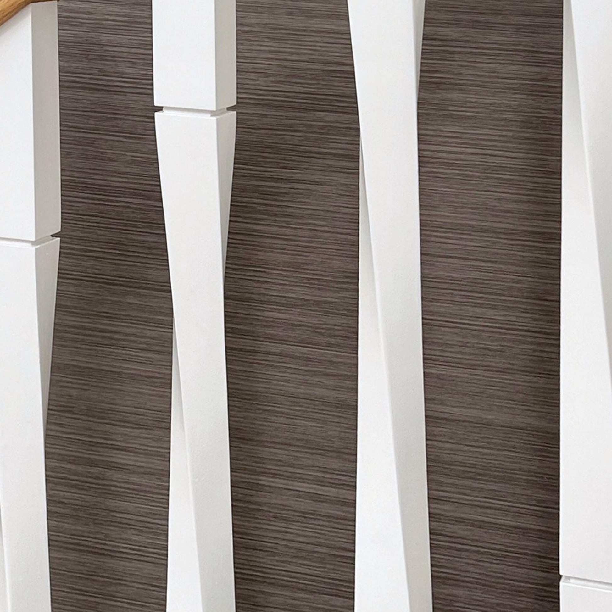 Close-up of white primed Roma spindles